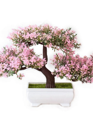 Plantas arbóreas pequeñas artificiales en macetas verdes