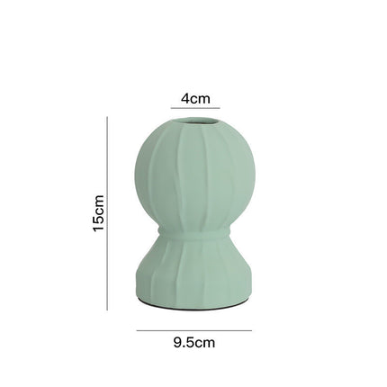 Arreglo floral minimalista moderno para sala de estar.