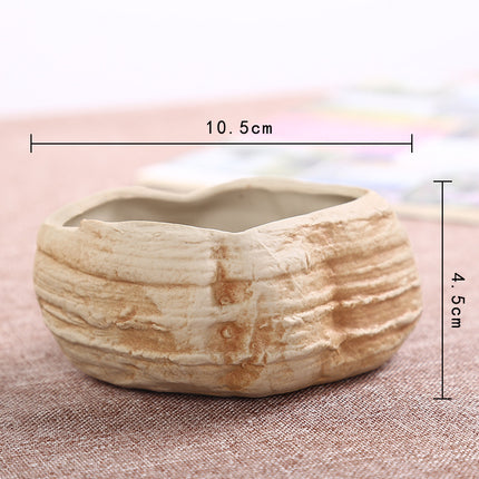 Mini maceta de piedra para suculentas, convertida en una creativa maceta de cerámica verde.
