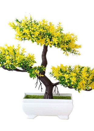 Plantas arbóreas pequeñas artificiales en macetas verdes